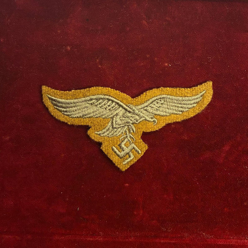 Aquila da berretto della Luftwaffe su fondo tropicale/Kaki