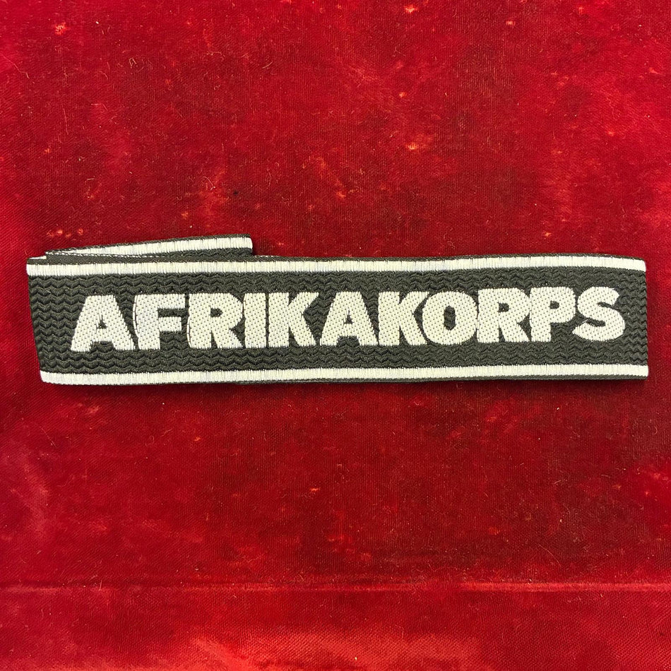 Fascetta da polso AFRIKA KORPS su fondo nero
