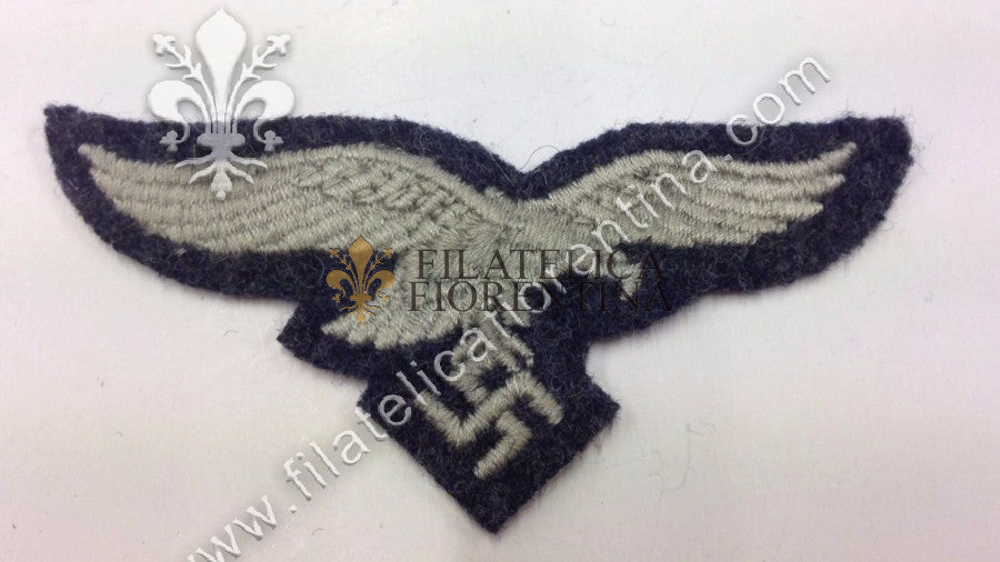 Aquila da bustina in filo grigio su fondo blu da Truppa ( variante )